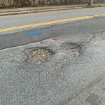 Pothole at 33 South St, Chestnut Hill