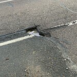 Pothole at 209 Newton St