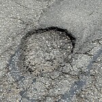 Pothole at 387–399 Kent St